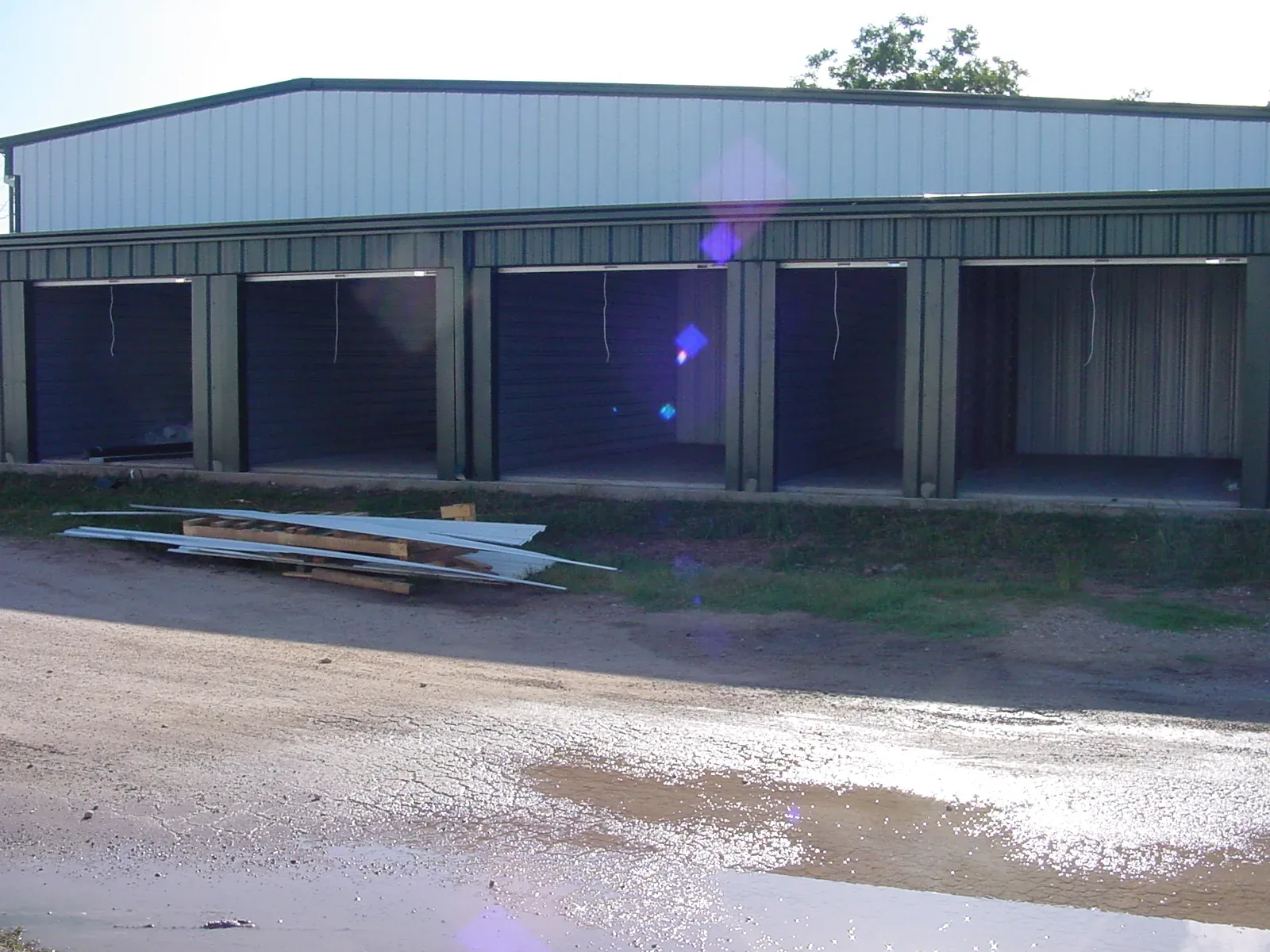 Self-storage building with a row of roll-up doors along its length